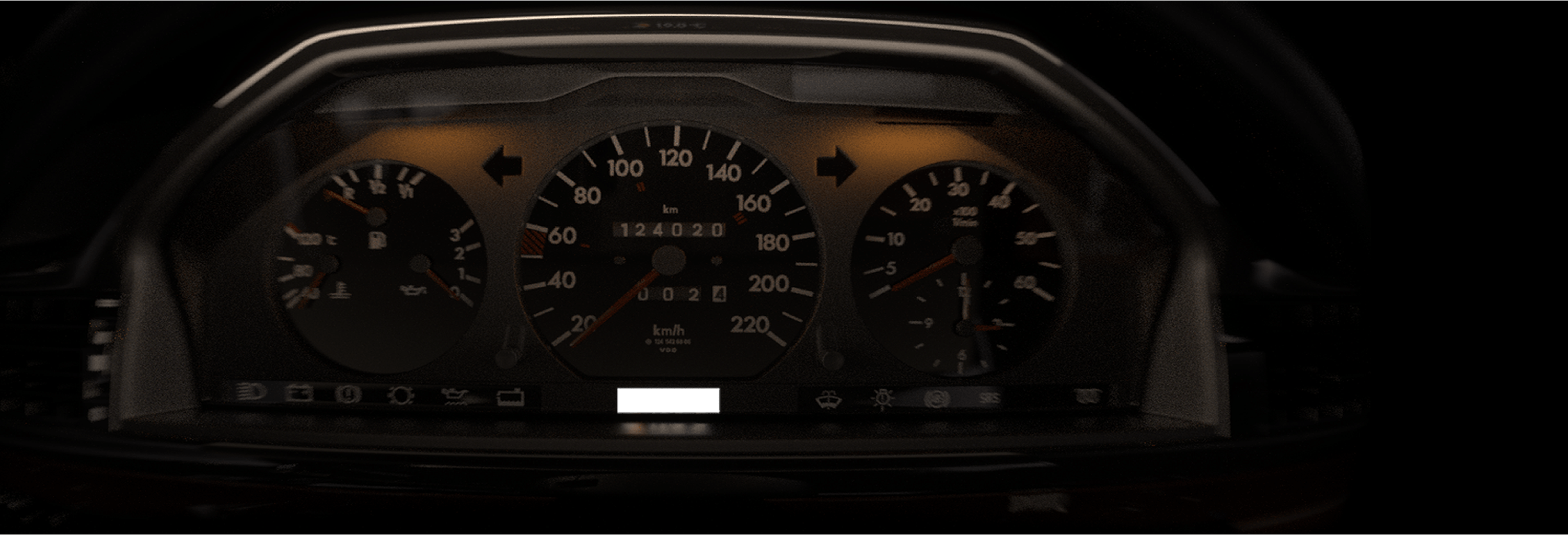 A close-up of a car dashboard instrument cluster with illuminated analog gauges, including a speedometer and tachometer, shown in low light.